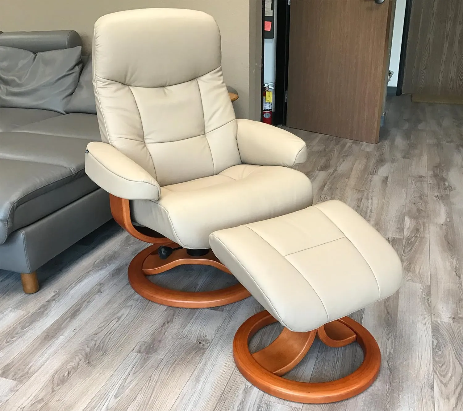 Small Leather Ergonomic Swivel Recliner Chair with Ottoman in Sandel NL 121 Nordic Line Leather with a Espresso Wood Stain Base