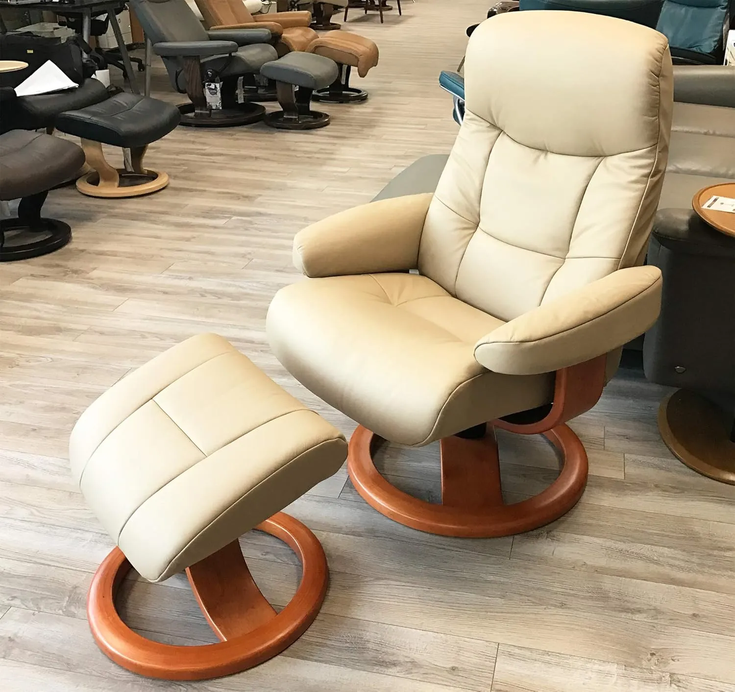 Small Leather Ergonomic Swivel Recliner Chair with Ottoman in Sandel NL 121 Nordic Line Leather with a Espresso Wood Stain Base